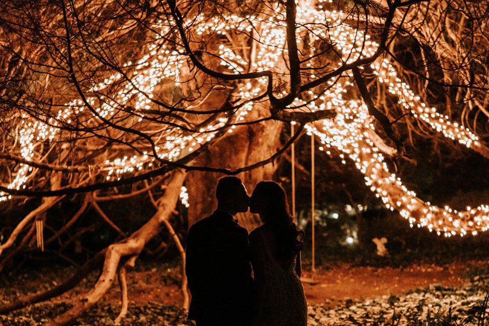 Wedding-Kiss-Bridal-Couple-Fairy-Lights-Dream-Wedding-Magical-Faraway-Tree-Garden-Wedding-Evening-Wedding-Swing-Jaspers-Berry-Enid-Blyton